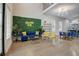 Bright living room with a blue sofa and gold accents at 975 Welch Sw St, Atlanta, GA 30310