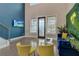 Spacious living area with a blue accent wall and large TV at 975 Welch Sw St, Atlanta, GA 30310
