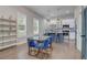 Modern kitchen with blue island and glass dining table at 975 Welch Sw St, Atlanta, GA 30310