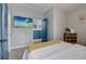 Bright bedroom with a comfortable bed and large TV at 975 Welch Sw St, Atlanta, GA 30310