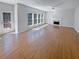 Bright living room with hardwood floors, fireplace, and sliding glass doors leading to a deck at 4670 Wynnmeade Sw Ln, Lilburn, GA 30047