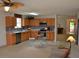 Open kitchen with light wood cabinets, stainless steel appliances, and a breakfast nook at 1007 Sycamore Ln, Villa Rica, GA 30180