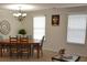 Well-lit dining area with a wooden table and chairs at 1007 Sycamore Ln, Villa Rica, GA 30180