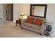 Cozy living room area featuring a comfortable sofa and ample natural light at 1007 Sycamore Ln, Villa Rica, GA 30180