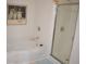 Bathroom with bathtub, shower, and plenty of light at 1007 Sycamore Ln, Villa Rica, GA 30180