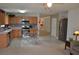 Open kitchen with light wood cabinets, stainless steel appliances, and a breakfast nook at 1007 Sycamore Ln, Villa Rica, GA 30180