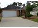 Brick ranch house with attached garage and neat landscaping at 1007 Sycamore Ln, Villa Rica, GA 30180