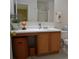 Clean bathroom with wood vanity, shower, and toilet at 1007 Sycamore Ln, Villa Rica, GA 30180