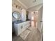 Elegant bathroom with double vanity, granite countertop, and a large mirror at 1950 Holland Park Dr, Buford, GA 30519