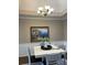 Charming dining area with a white table, gray chairs, and elegant chandelier at 1950 Holland Park Dr, Buford, GA 30519