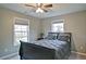 Comfortable bedroom with a ceiling fan and large windows at 258 Chadwyck Ln, Canton, GA 30115