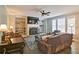 Relaxing Gathering room with a fireplace, built-in shelving and leather furniture at 258 Chadwyck Ln, Canton, GA 30115