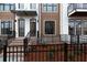 Two townhome entrances with brick steps and black metal fencing at 326 Olmstead Way # 41, Alpharetta, GA 30022