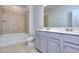 Modern bathroom with double vanity and a shower/tub combo at 3409 Ripple Loop # 126, South Fulton, GA 30349