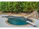 Inviting pool with slide, spa, and waterfall feature at 1012 Legacy Hills Dr, Mcdonough, GA 30253