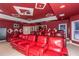 Home theater with red reclining seats and large screen at 1012 Legacy Hills Dr, Mcdonough, GA 30253