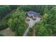 Aerial view of a large brick house and its surroundings at 1012 Legacy Hills Dr, Mcdonough, GA 30253