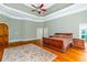 Large main bedroom with hardwood floors and tray ceiling at 1012 Legacy Hills Dr, Mcdonough, GA 30253