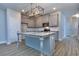 Modern kitchen with island, stainless steel appliances, and light-grey cabinets at 3401 Ripple Loop # 128, South Fulton, GA 30349