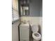 Small bathroom with white tile and vanity at 137 Hillcrest Dr, Austell, GA 30168