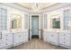 Luxurious bathroom with double vanities, large mirrors, and glass enclosed shower at 2761 Major Ridge Trl, Duluth, GA 30097