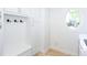 Bright laundry room with built-in cabinets and bench at 2761 Major Ridge Trl, Duluth, GA 30097