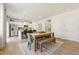 Open concept kitchen and dining area with island, stainless steel appliances, and hardwood floors at 8659 Paradise Dr, Douglasville, GA 30134