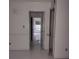 Hallway with new white flooring and fresh paint at 2968 Parc Lorraine, Lithonia, GA 30038