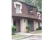 Condo building exterior, brown roof, tan siding, landscaping, and walkway at 2968 Parc Lorraine, Lithonia, GA 30038