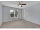 Spacious bedroom with ceiling fan and neutral walls at 1463 Edgemont Pt, Lawrenceville, GA 30044