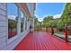 Red stained deck overlooks fenced backyard at 1463 Edgemont Pt, Lawrenceville, GA 30044