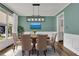 Elegant dining room with hardwood floors, a chandelier, and built-in cabinetry at 1463 Edgemont Pt, Lawrenceville, GA 30044