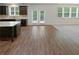 Open kitchen with access to the backyard and a breakfast bar at 368 Madison Grace Ave, Mcdonough, GA 30252