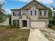 Two story brick house with two car garage at 368 Madison Grace Ave, Mcdonough, GA 30252