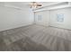 Spacious bedroom with carpet flooring and two large windows at 368 Madison Grace Ave, Mcdonough, GA 30252