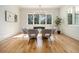 Elegant dining room featuring a glass-top table and hardwood floors at 2731 Ridgewood Nw Rd, Atlanta, GA 30327