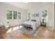 Bright bedroom with hardwood floors, large windows, and stylish furnishings at 2731 Ridgewood Nw Rd, Atlanta, GA 30327