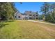 Stunning two-story home with stone and white exterior, lush lawn at 2731 Ridgewood Nw Rd, Atlanta, GA 30327