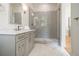 Spa-like bathroom with marble vanity, gray tile shower, and marble floors at 2731 Ridgewood Nw Rd, Atlanta, GA 30327