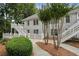 Exterior view of a condo building with landscaping at 608 Abingdon Way, Atlanta, GA 30328