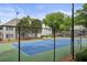 View of a tennis court within a community at 608 Abingdon Way, Atlanta, GA 30328