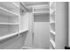 Spacious walk-in closet with built-in shelving and plenty of hanging space at 1755 Durrett Cv, Atlanta, GA 30338