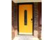 Bright yellow front door with black frame at 2696 Eldorado Pl, Snellville, GA 30078