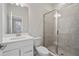 Clean bathroom with white vanity, large mirror and shower at 6300 Misty Hill Ln, Buford, GA 30518