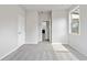 Bright bedroom with neutral walls, carpeting, and access to another room at 6300 Misty Hill Ln, Buford, GA 30518