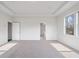 Large bedroom with carpet and access to bathroom at 6300 Misty Hill Ln, Buford, GA 30518
