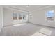 Bright and spacious bedroom with carpeted floor and large windows at 6300 Misty Hill Ln, Buford, GA 30518