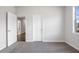 Bright bedroom featuring neutral walls and carpet at 6300 Misty Hill Ln, Buford, GA 30518