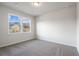 Spacious bedroom with neutral walls and carpet flooring at 6300 Misty Hill Ln, Buford, GA 30518