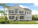 Two-story house with gray siding, brick accents, and a front porch at 6300 Misty Hill Ln, Buford, GA 30518